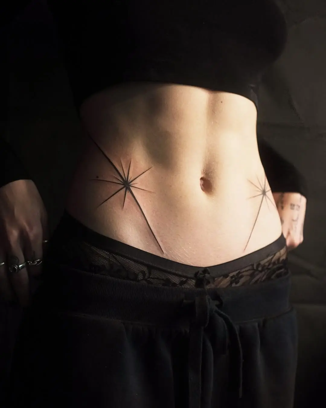 Minimalist Waist Tattoos with Star Designs