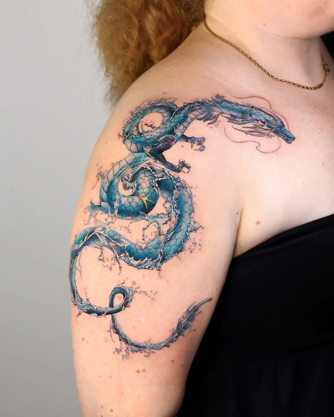 Intricate water dragon tattoo with fluid design