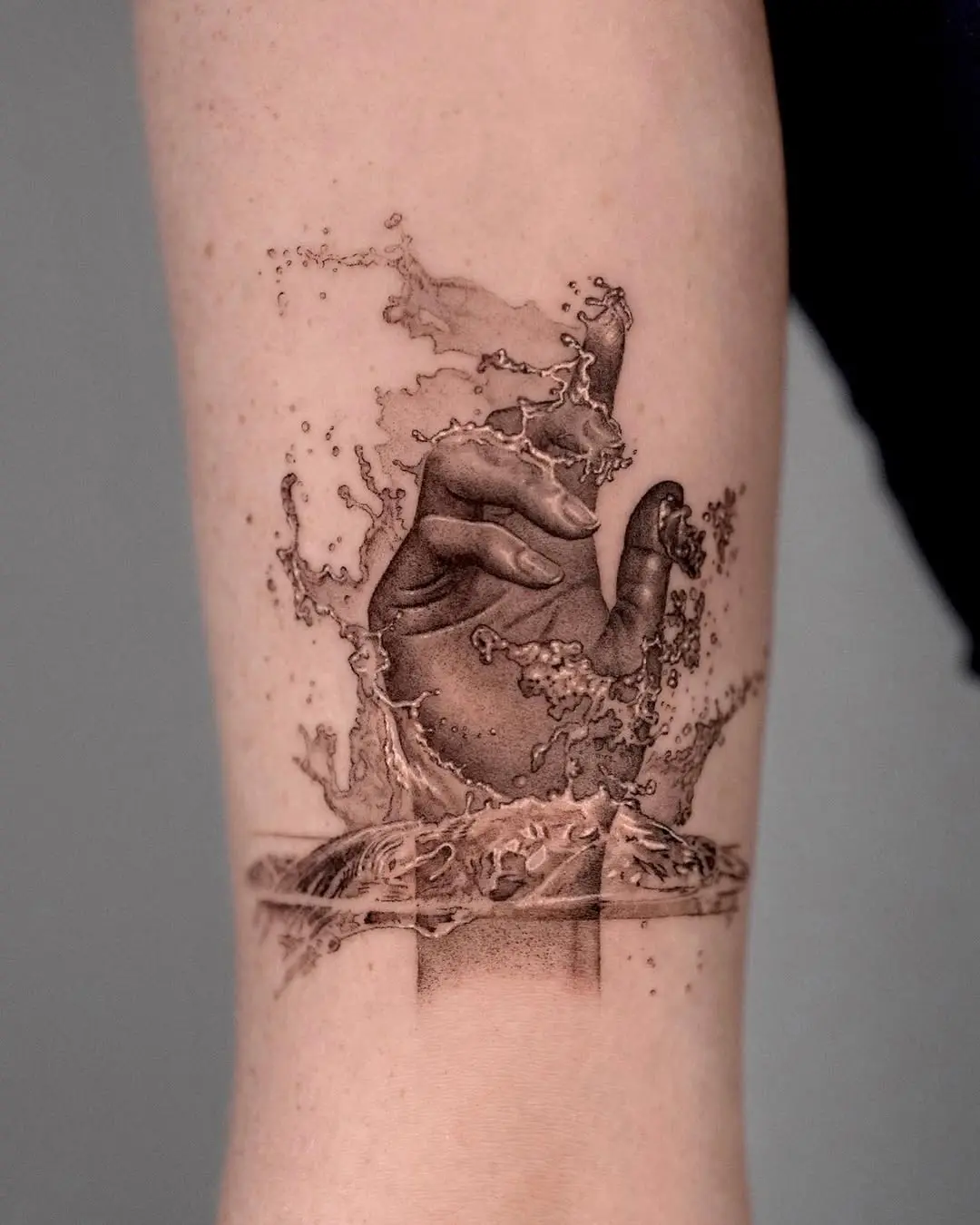 Stunning Water Tattoo Creating Motion and Depth