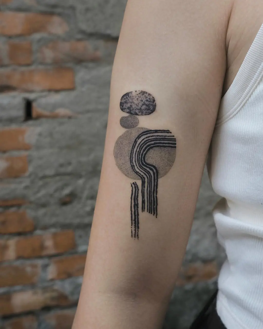 Modern abstract water-themed tattoo showcases unique style