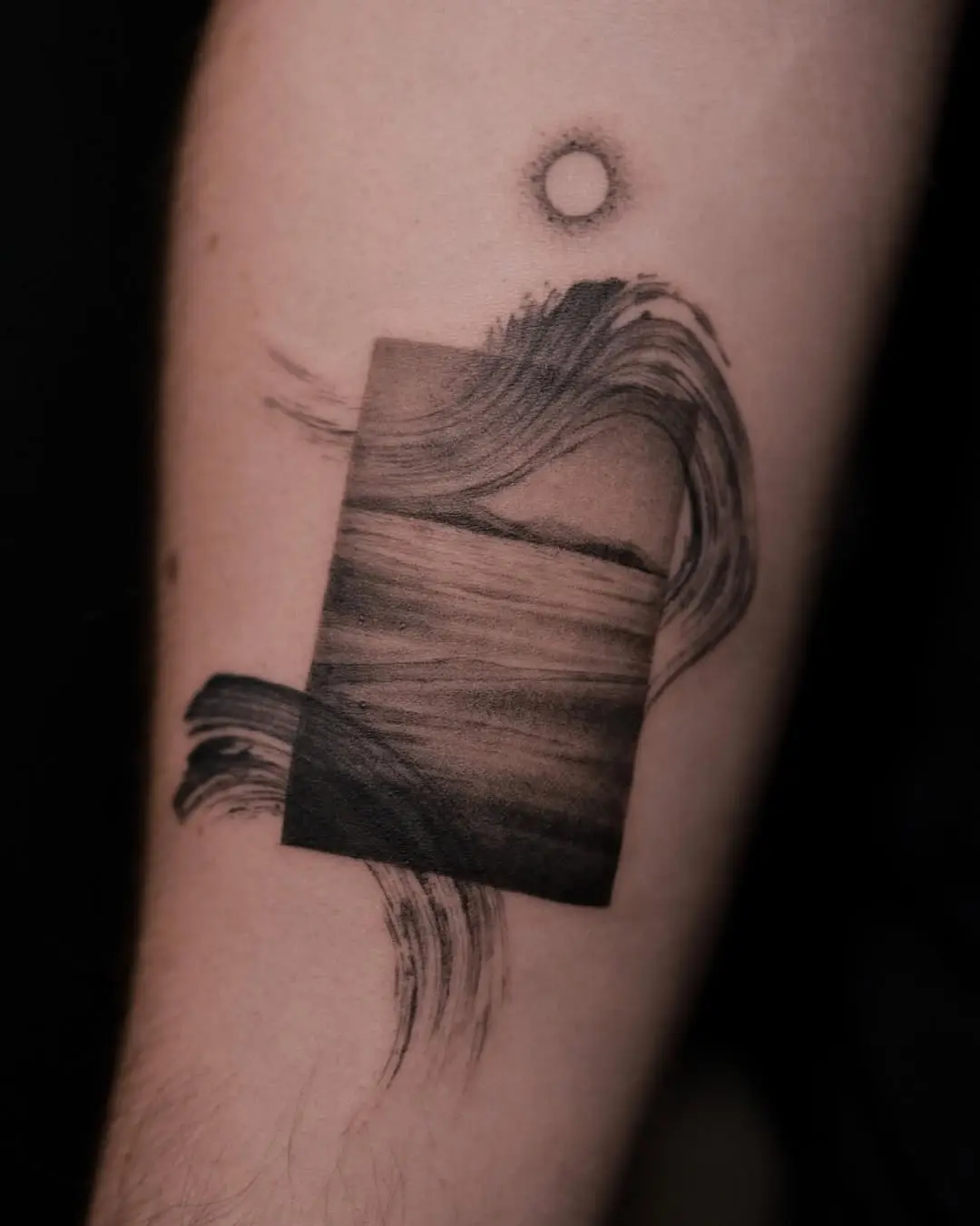 Flowing waves and tranquil sun tattoo art