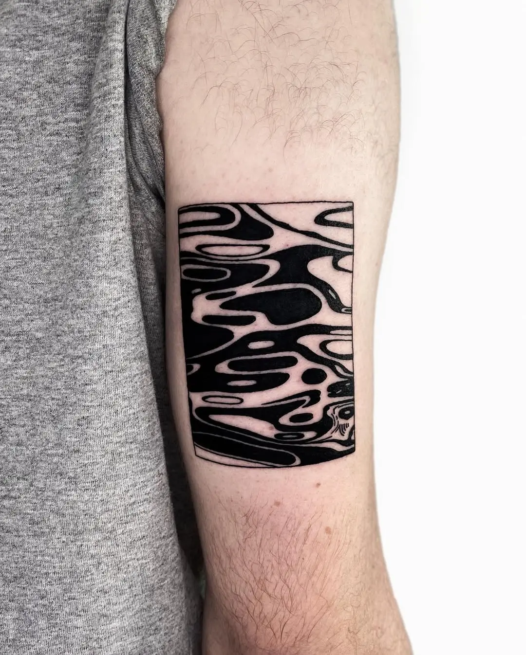 Abstract water tattoo in bold black ink