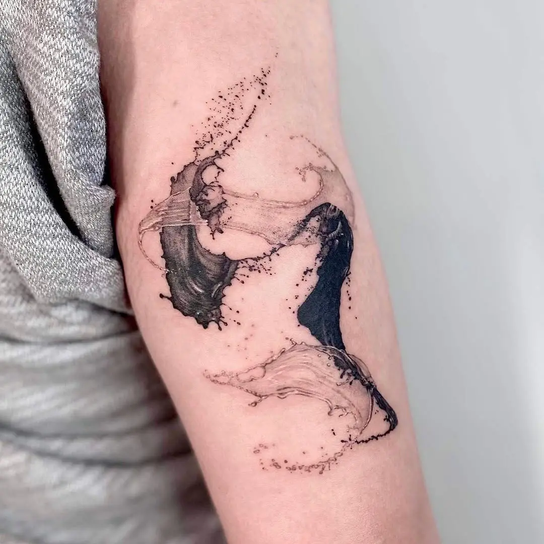Elegant water swirl tattoo on the arm