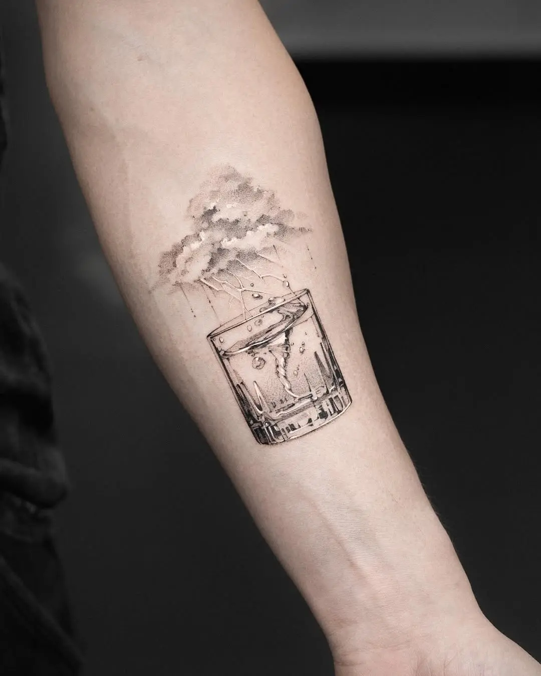 Whimsical water tattoo of glass and clouds