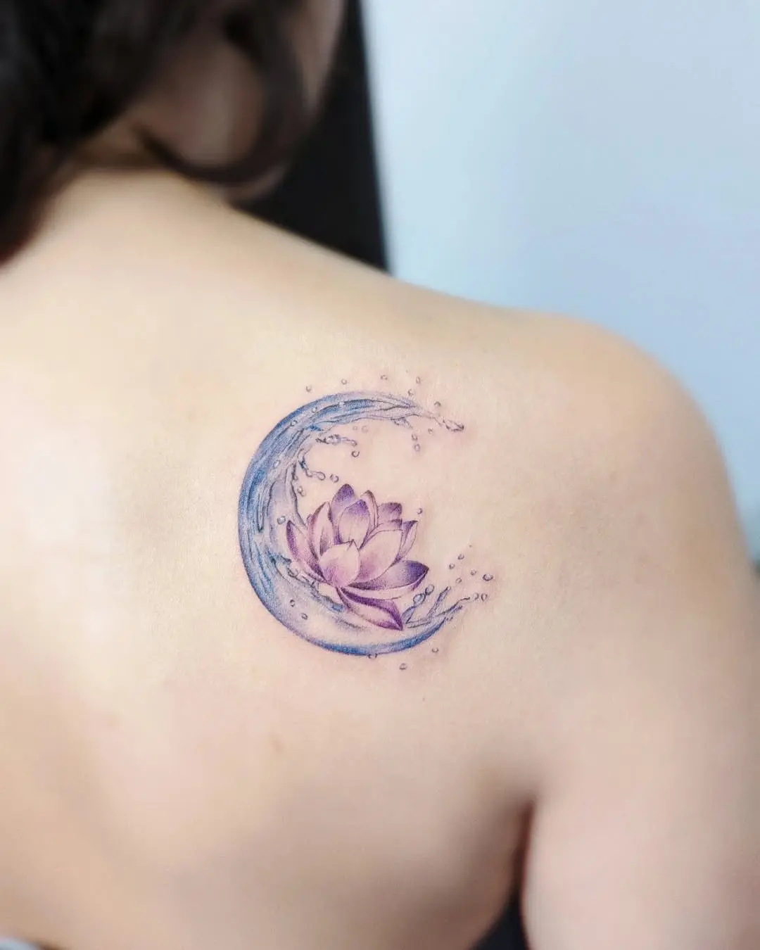 Elegant water lotus tattoo embracing tranquility