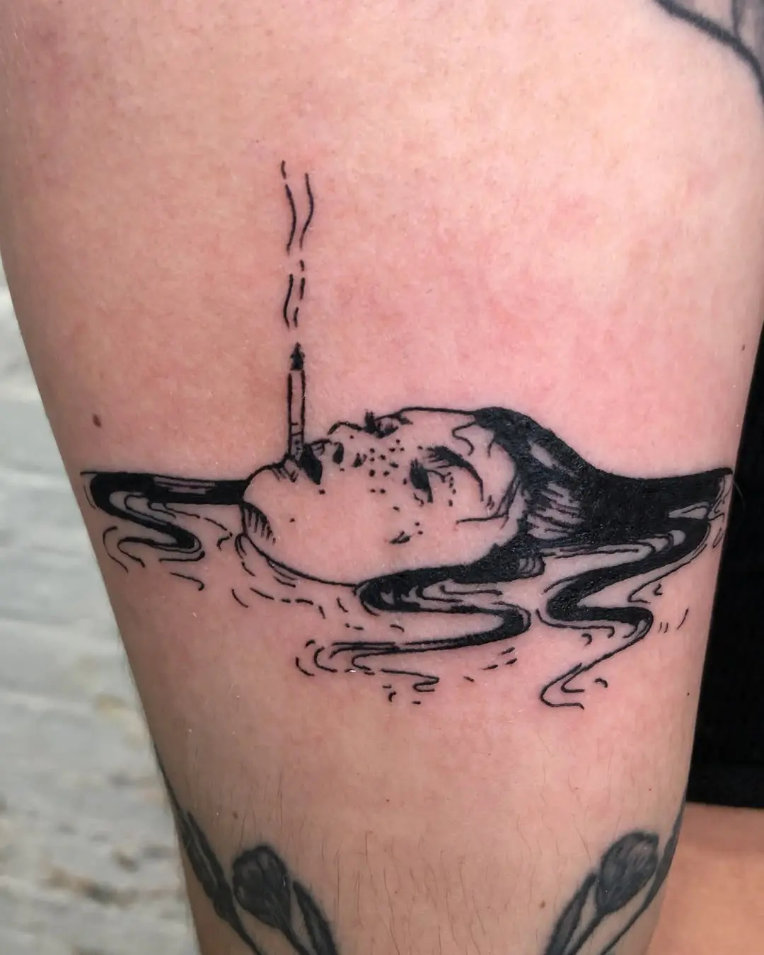 Sinking figure with a cigarette in water
