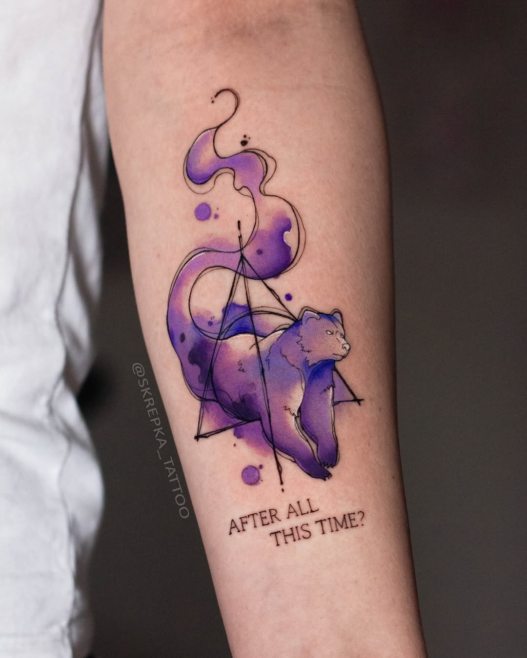Vibrant watercolor bear tattoo with geometric elements