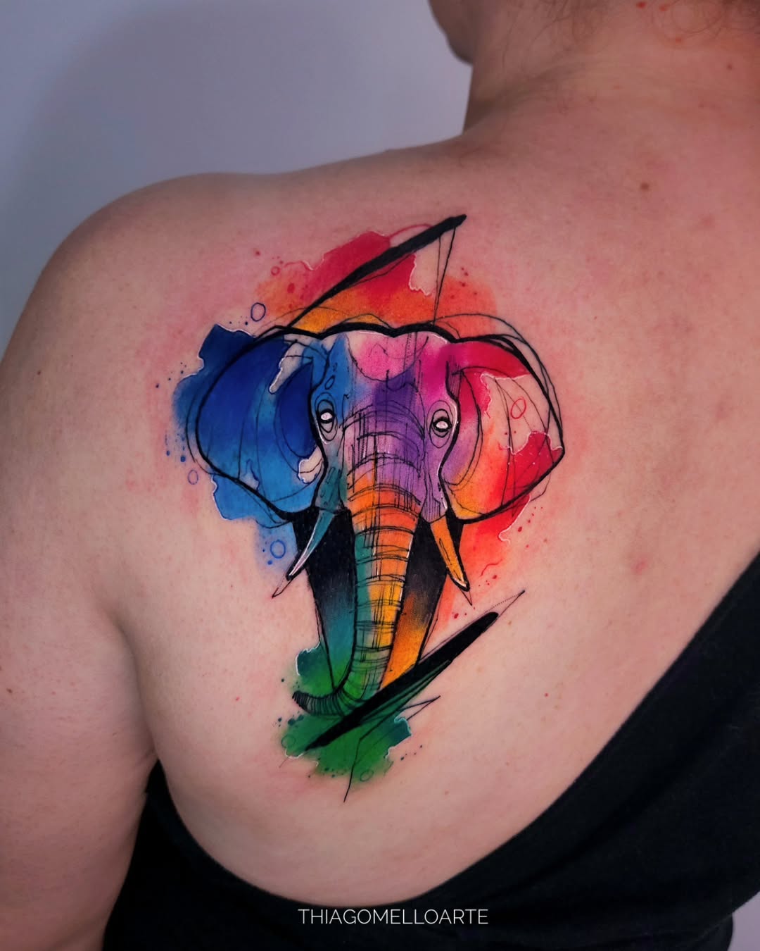 Vibrant watercolor elephant tattoo with bold hues