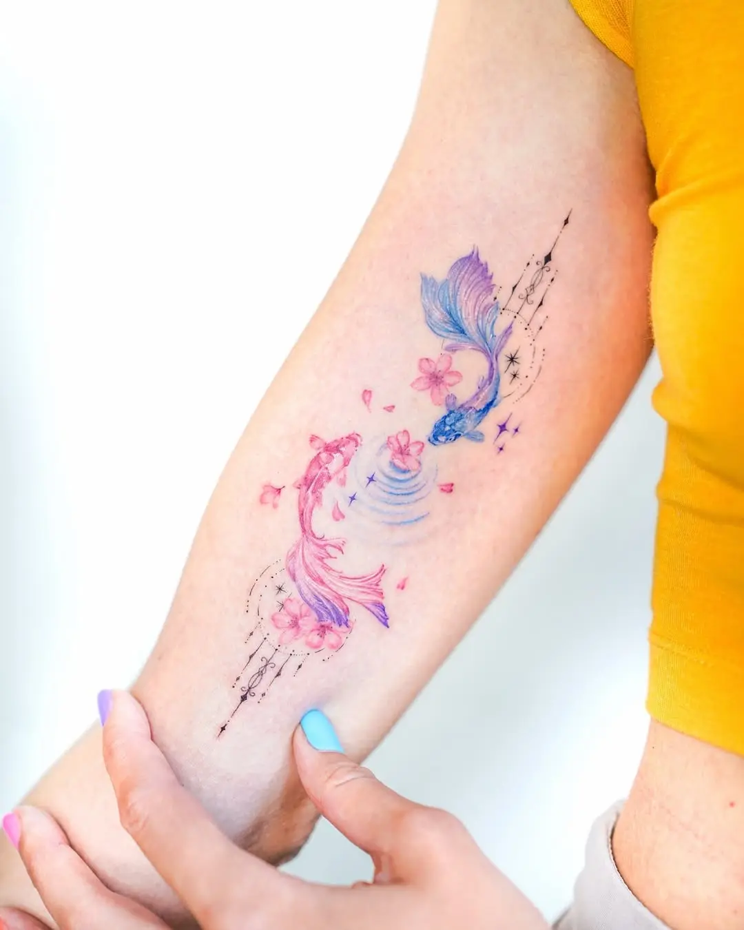Delicate Watercolor Fish Tattoo Design