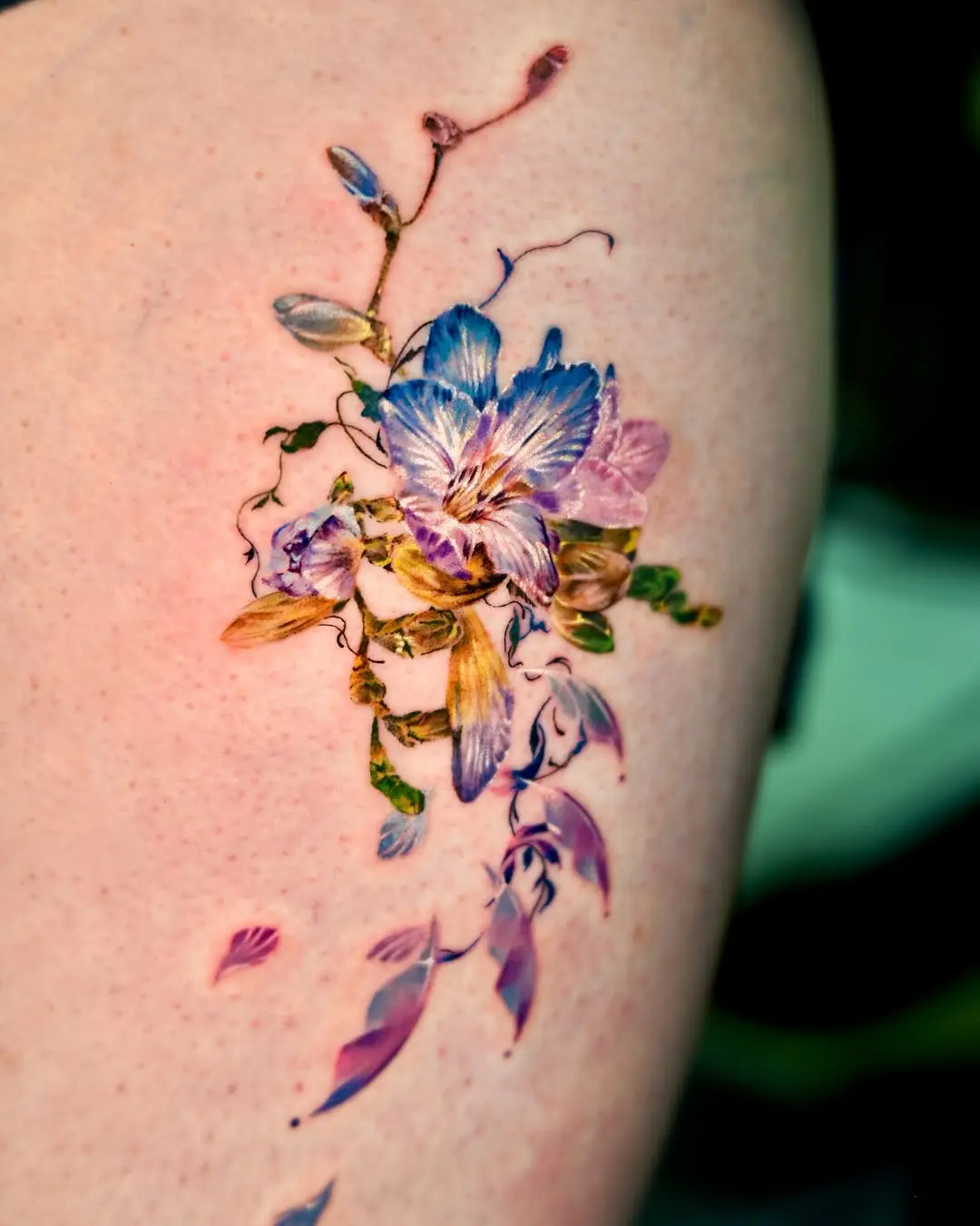 Vibrant floral watercolor tattoo design