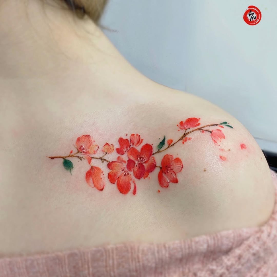Elegant floral watercolor tattoo on the shoulder