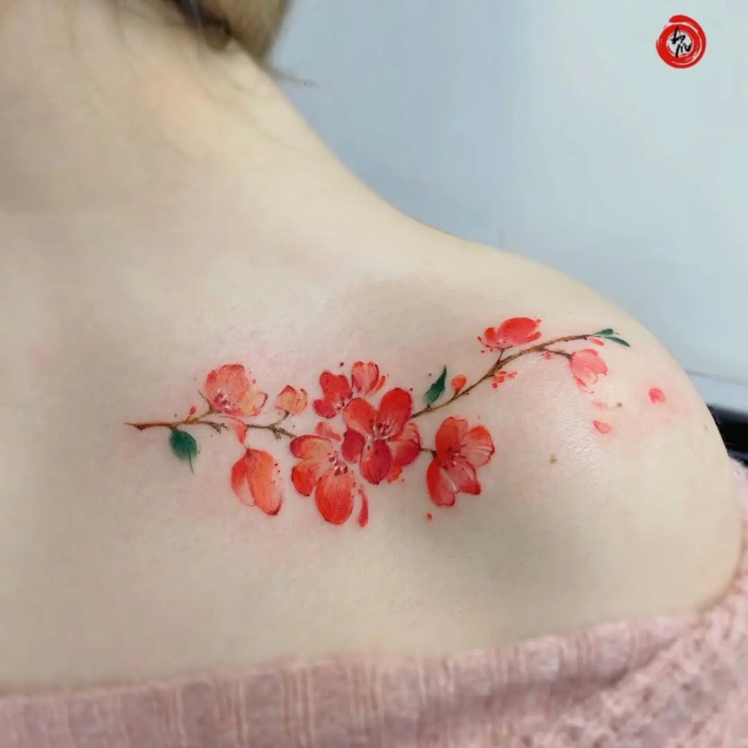 Elegant floral watercolor tattoo on the shoulder