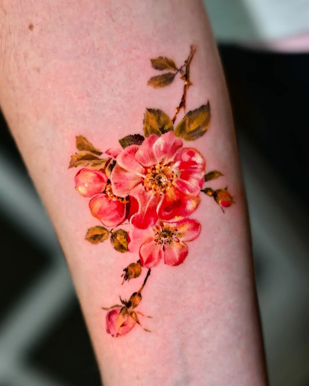 Elegant watercolor rose tattoo showcasing vibrant colors