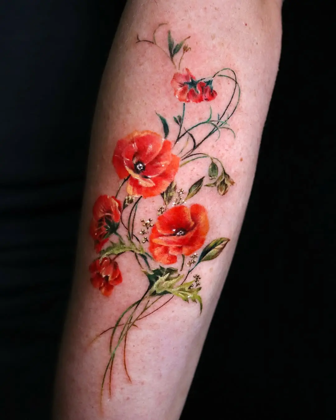 Stunning watercolor floral tattoo with lively colors