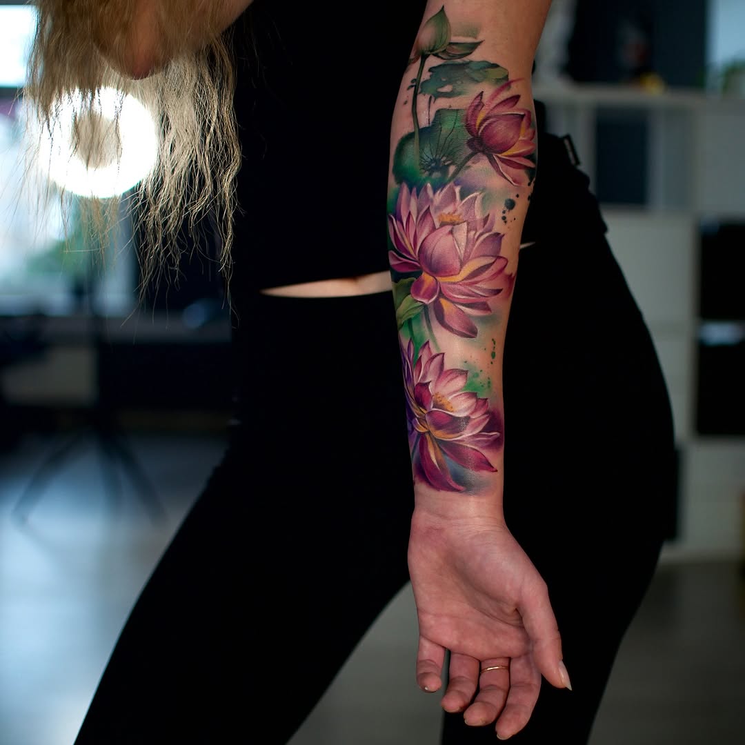 Vibrant watercolor lotus flower tattoo design
