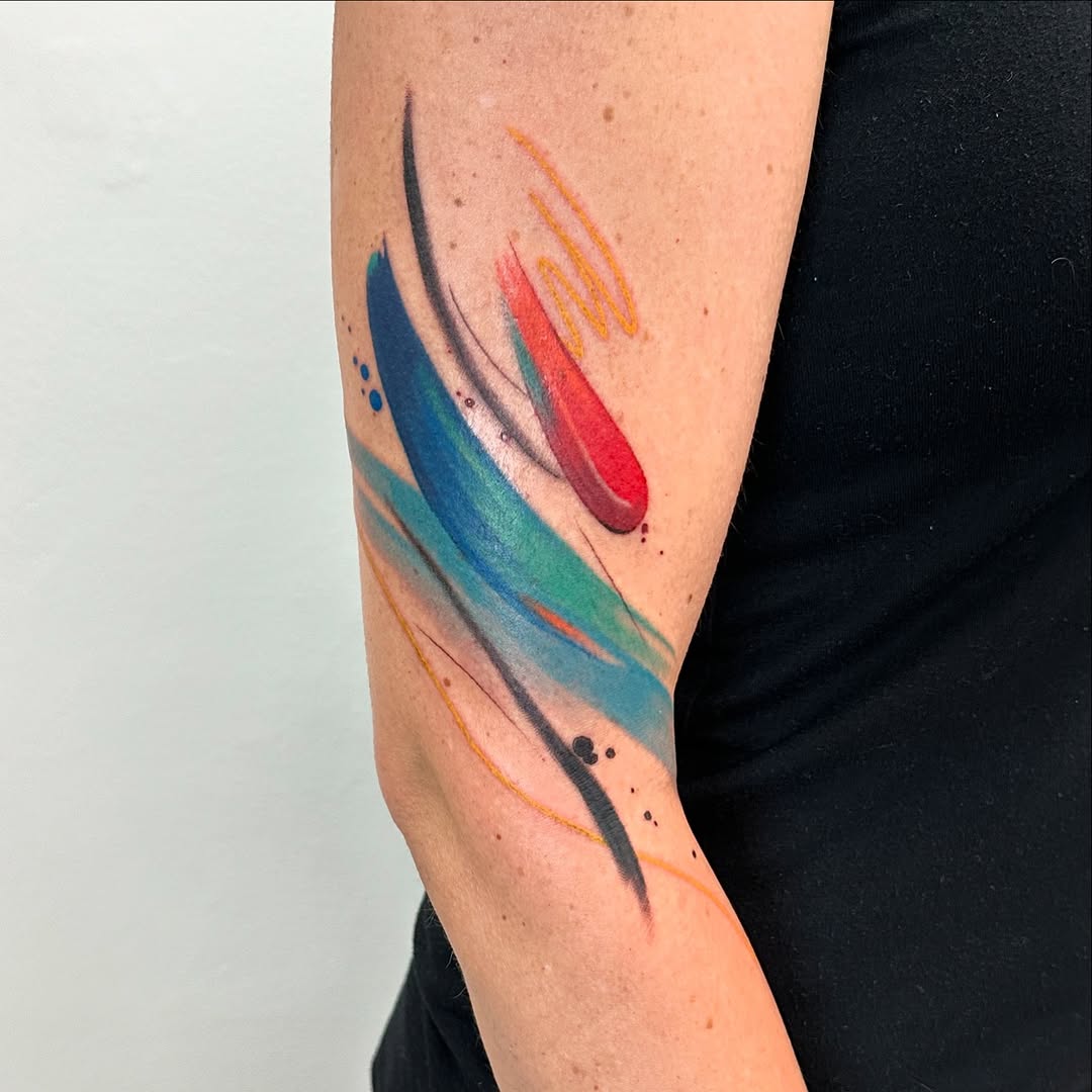 Vibrant abstract watercolor tattoo design