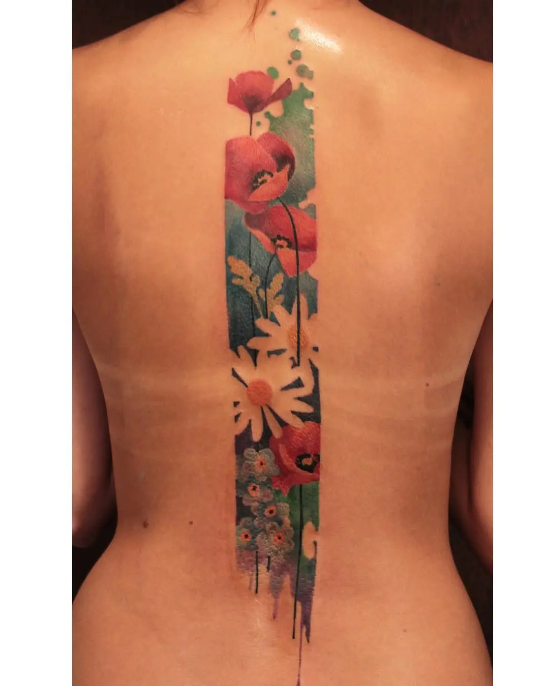 Stunning floral watercolor back tattoo art