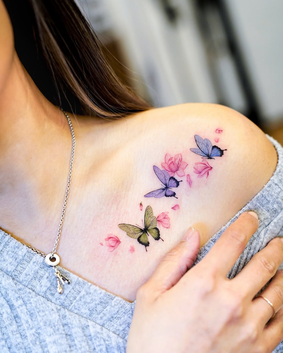Vibrant Butterflies and Floral Watercolor Tattoo