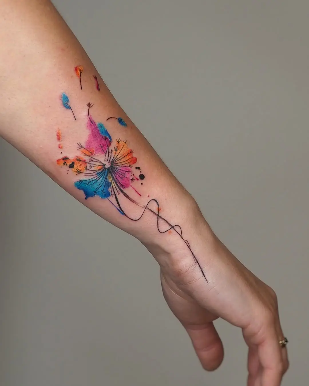 Vibrant butterfly tattoo with flowing fine lines