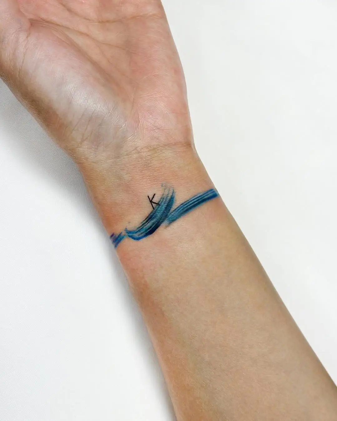 Minimalist watercolor tattoo on the wrist