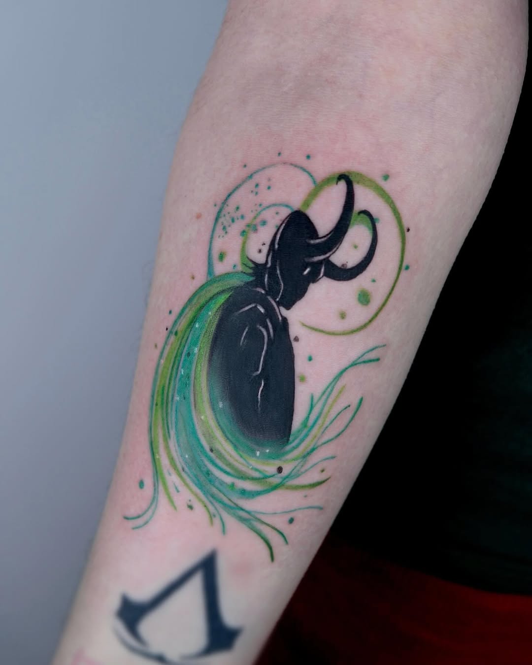 Vibrant octopus watercolor tattoo with flowing design