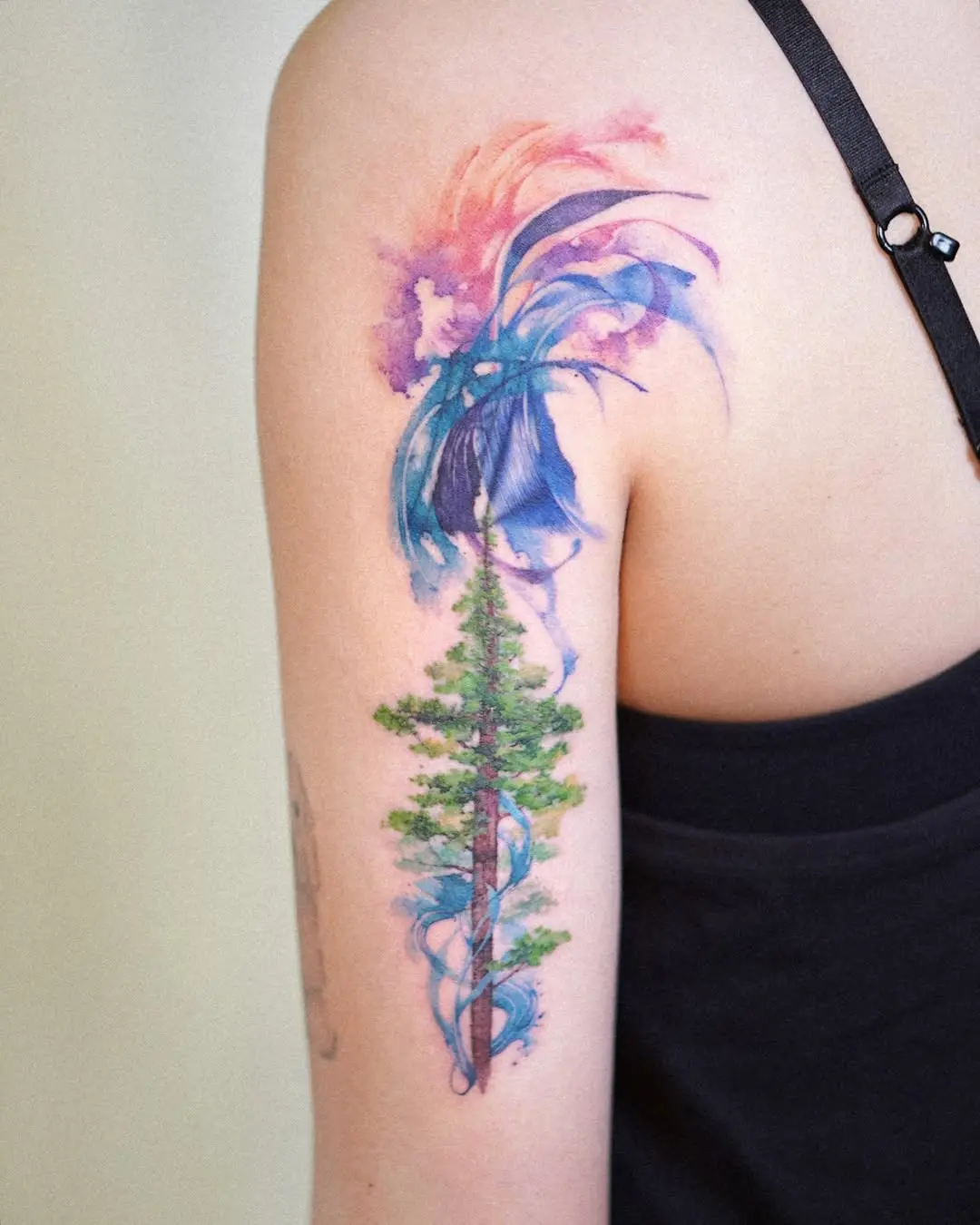 Stunning watercolor tree tattoo on skin