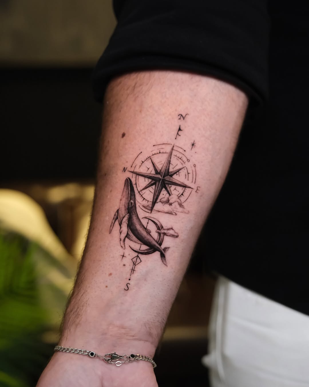 Whimsical compass tattoo with whale element