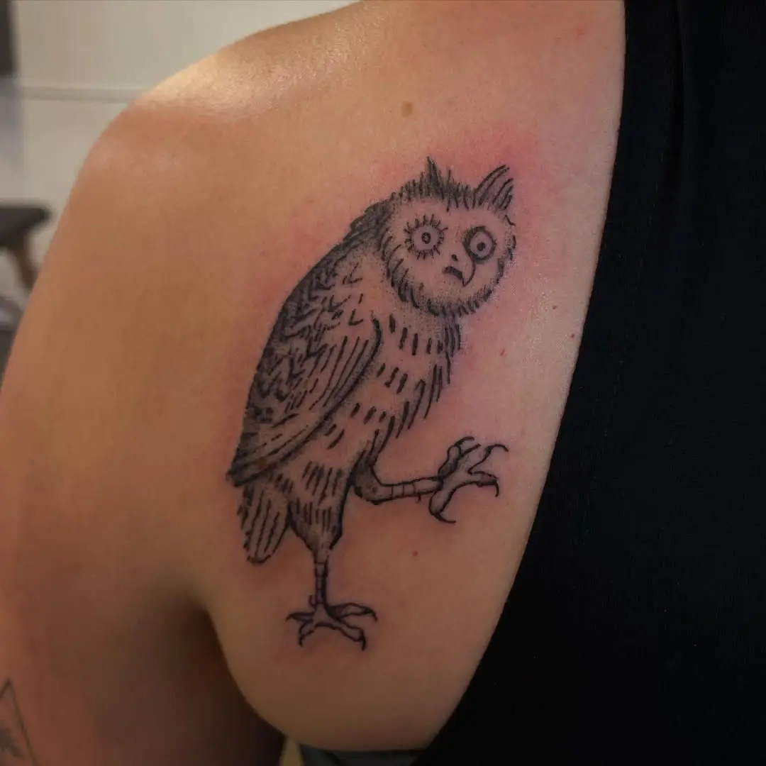 Charming owl tattoo with a quirky design