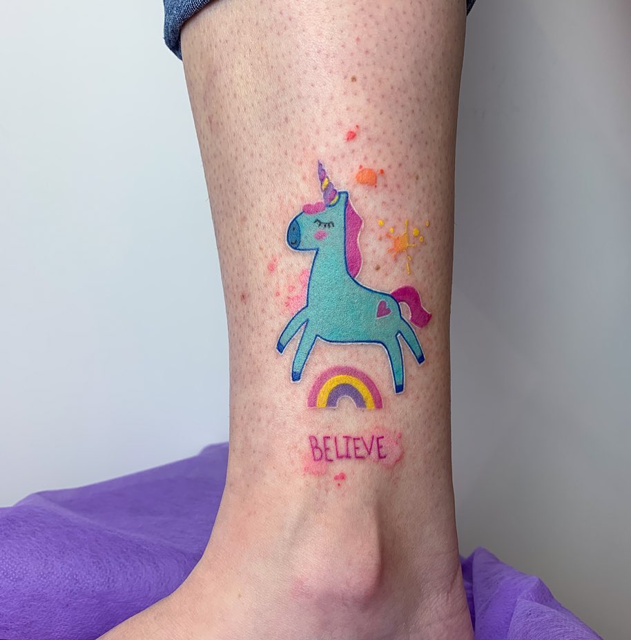 Colorful unicorn tattoo with a rainbow vibe