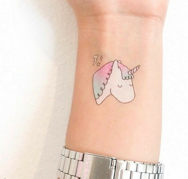 Charming unicorn tattoo with a playful design