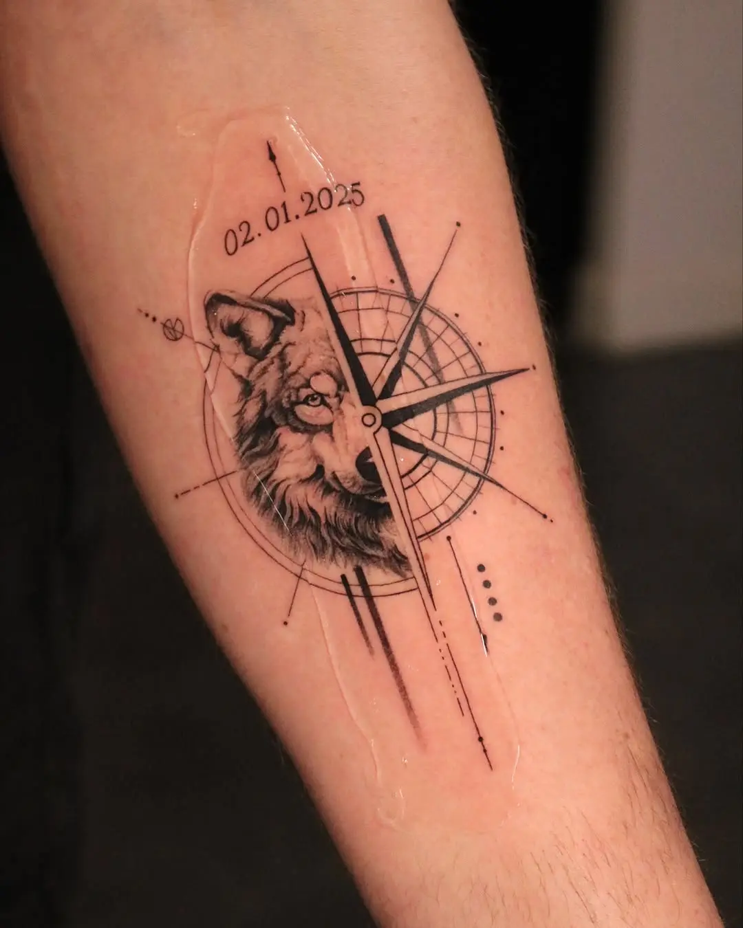 Stylish compass tattoo with wolf detail