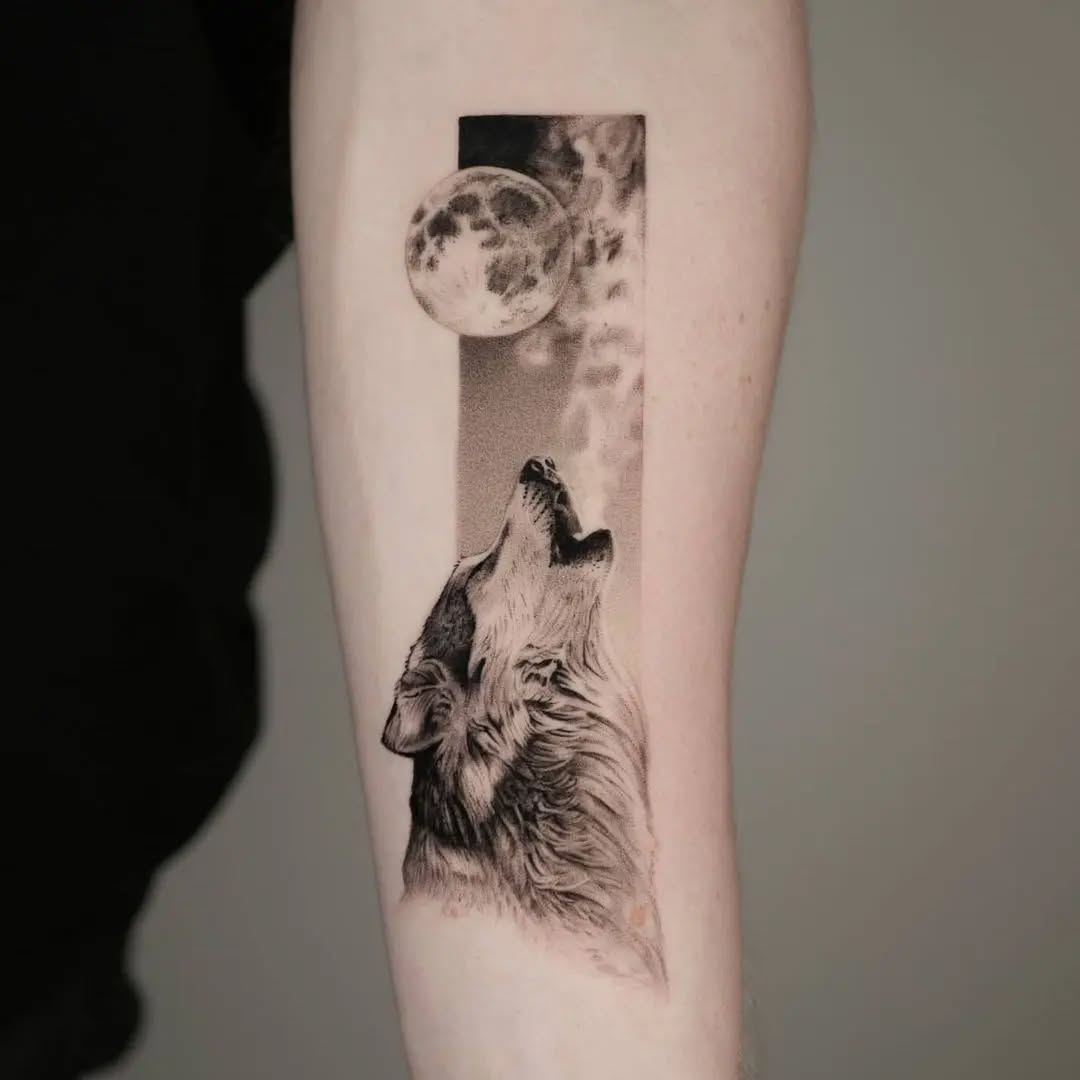 Majestic wolf howling at the moon tattoo