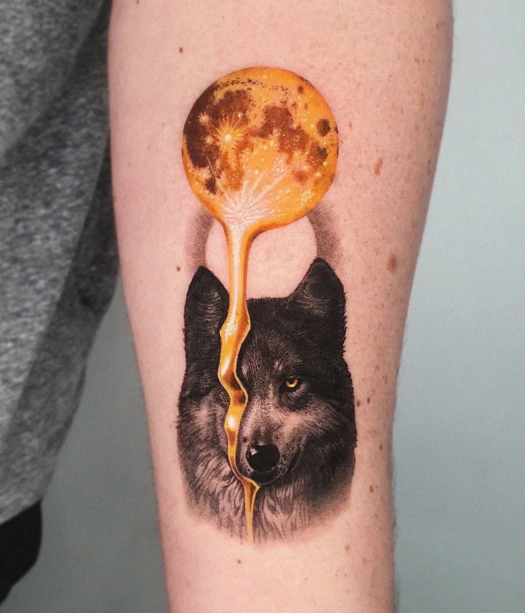 Artistic wolf tattoo with moonlit details