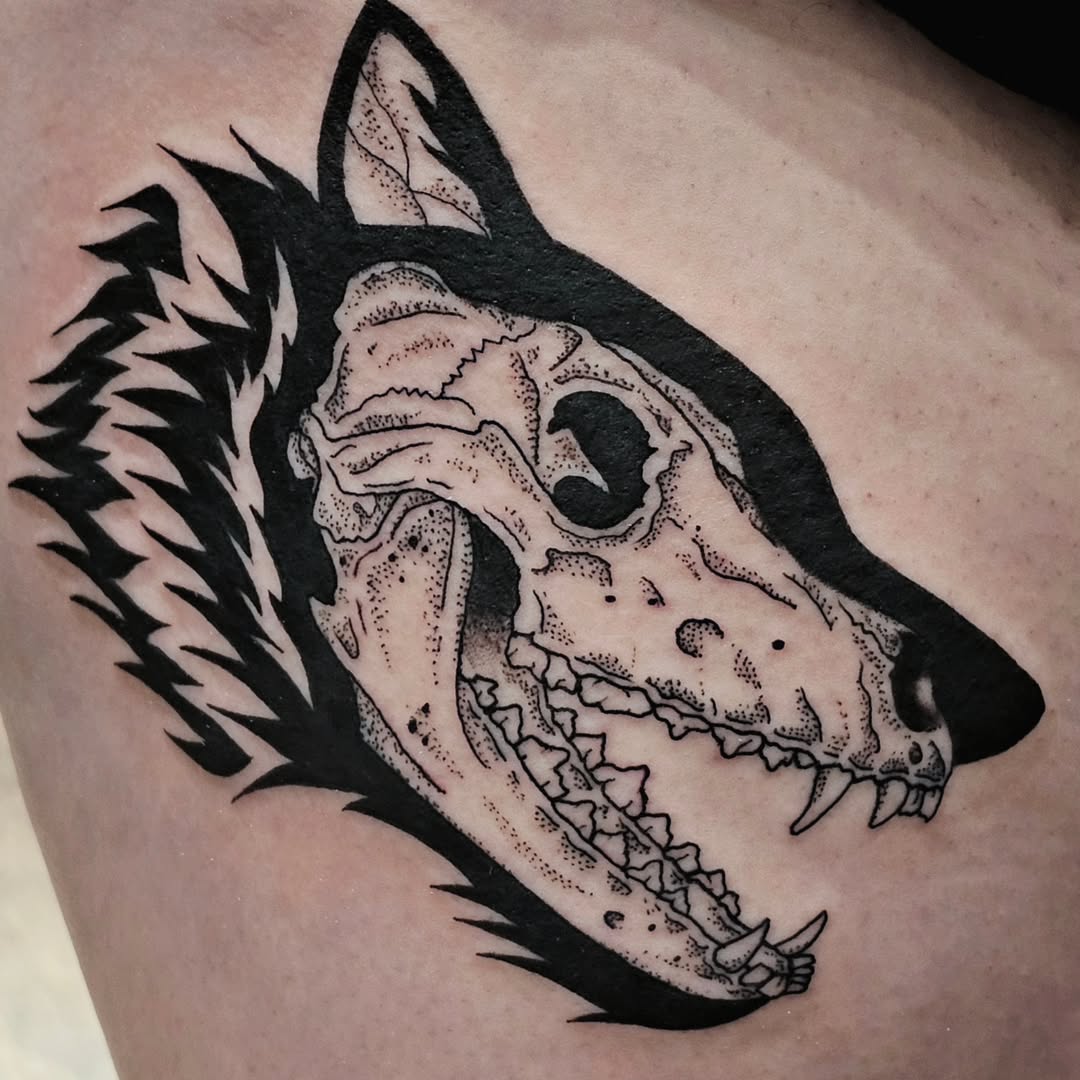 Intricate blackwork wolf skull tattoo design