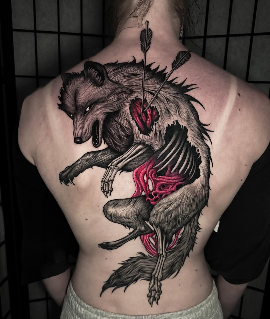 Dynamic wolf tattoo with striking colors