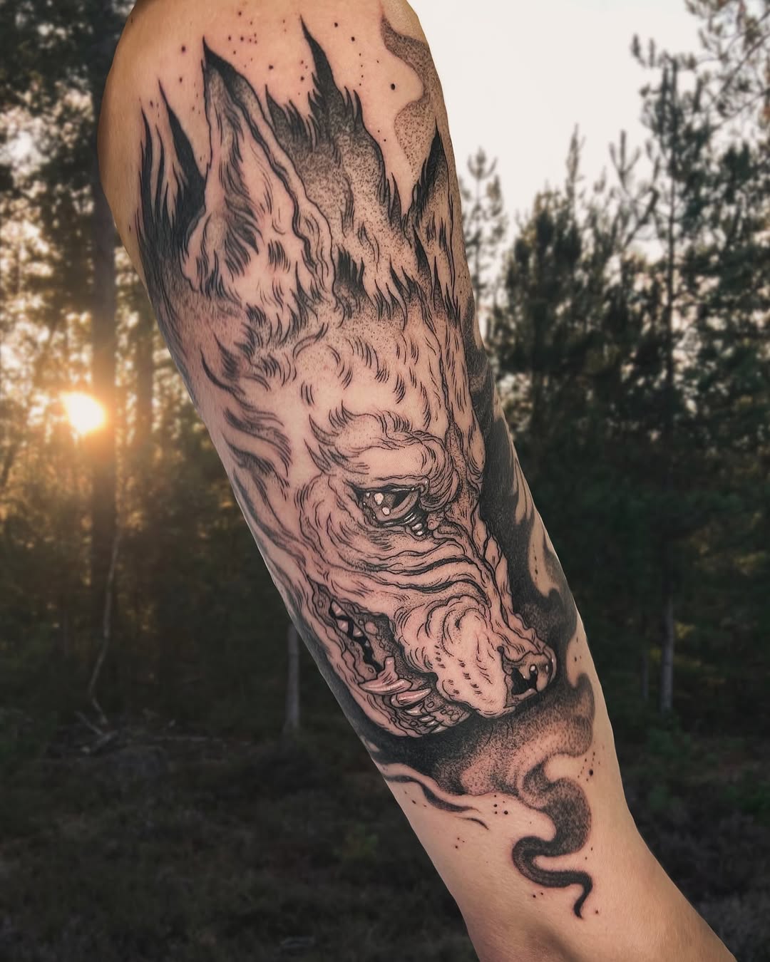 Intricate wolf tattoo in a natural setting