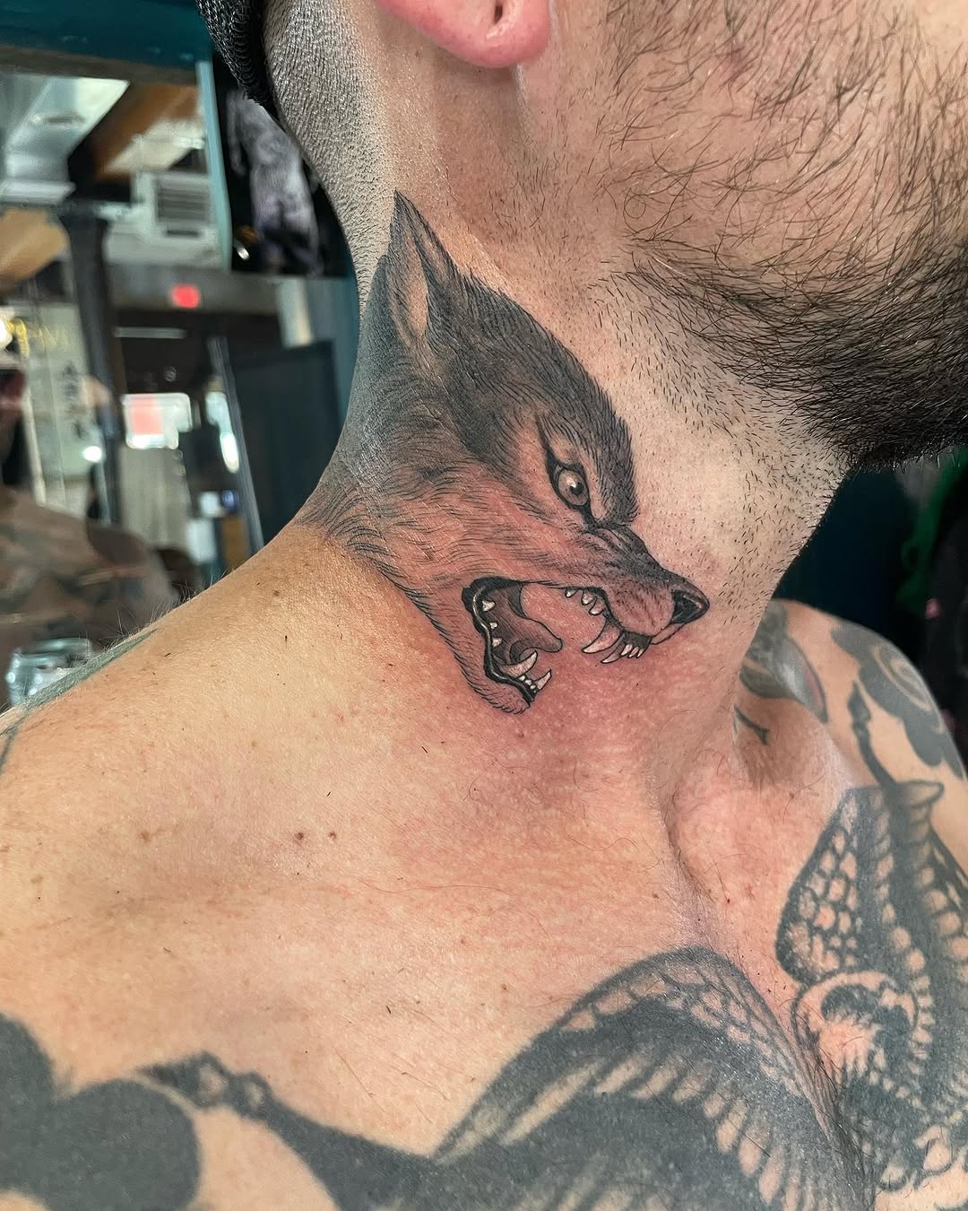 Realistic wolf tattoo design on the neck