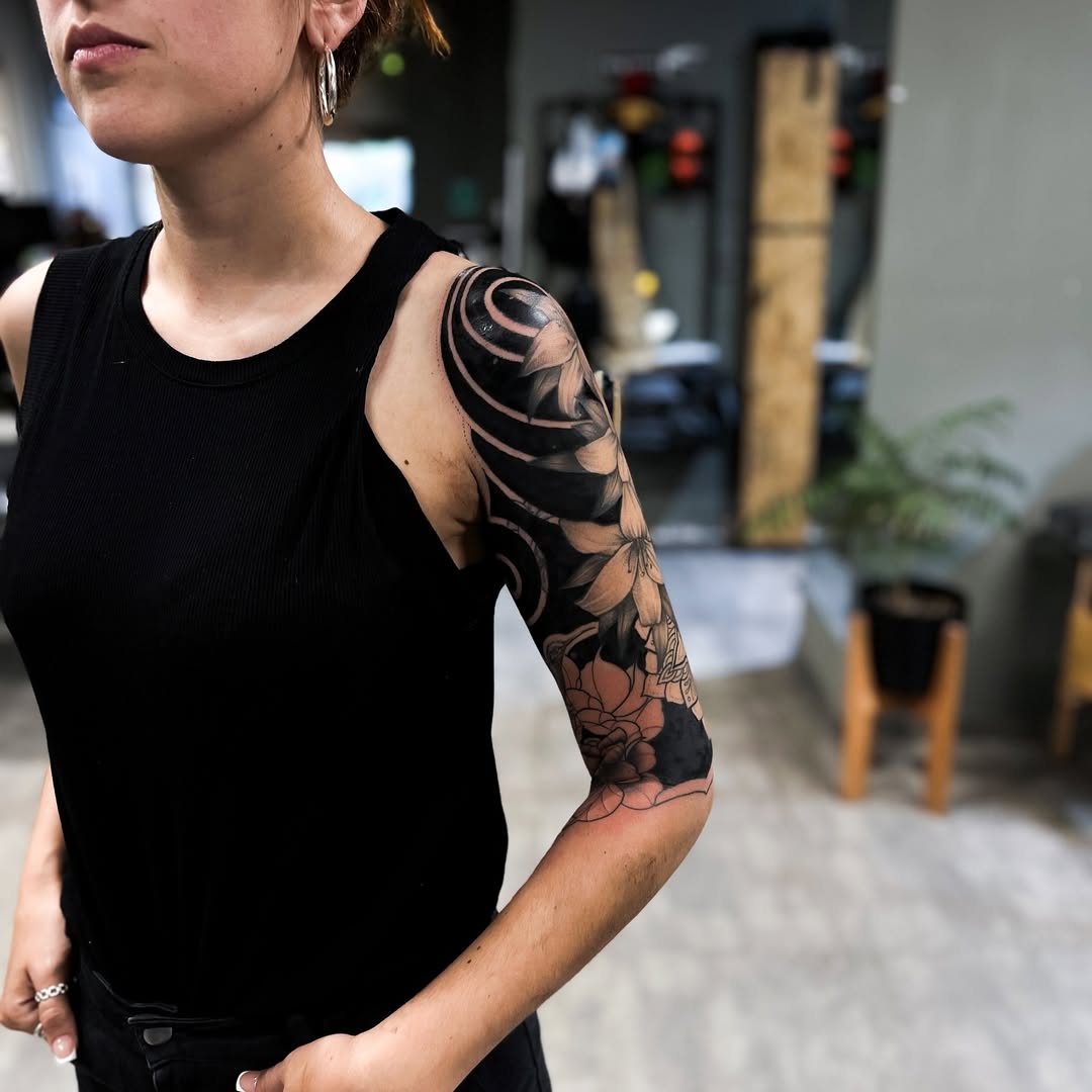 Stunning floral black sleeve tattoo design