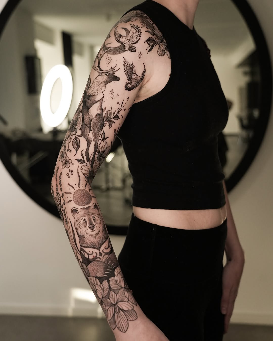 Intricate Flora and Fauna Sleeve Tattoo Design