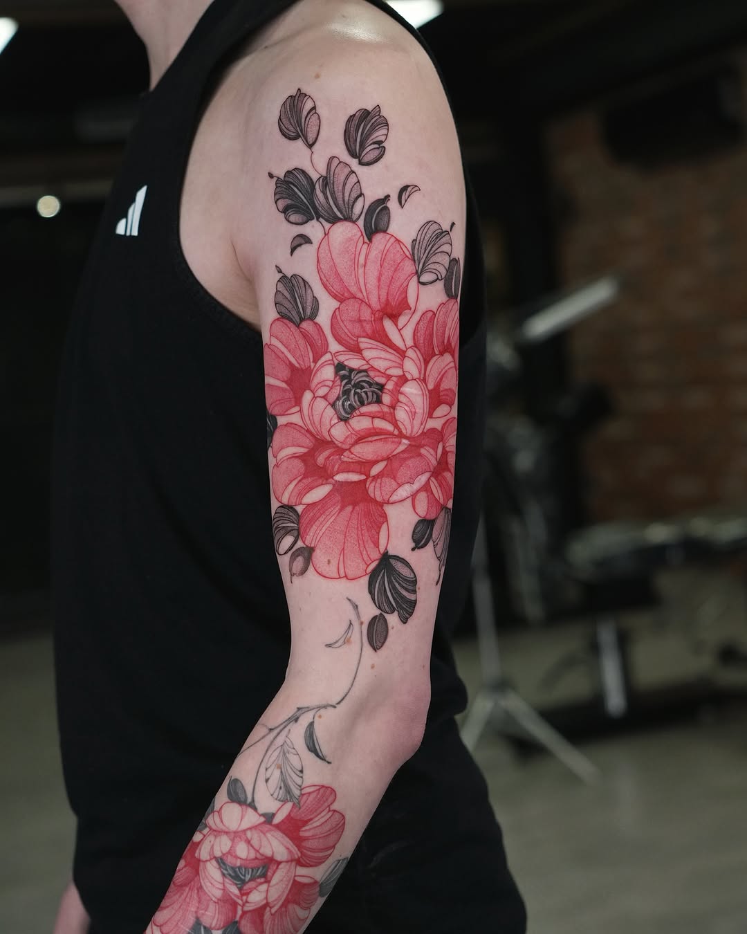 Stunning floral sleeve tattoo with vibrant hues