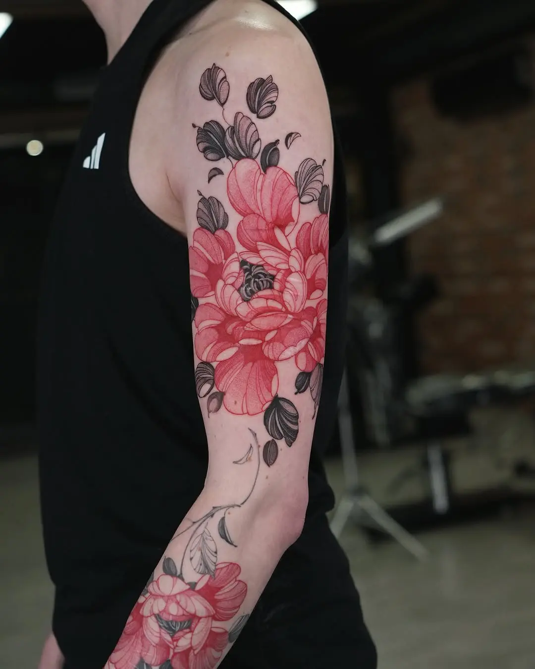 Stunning floral sleeve tattoo with vibrant hues