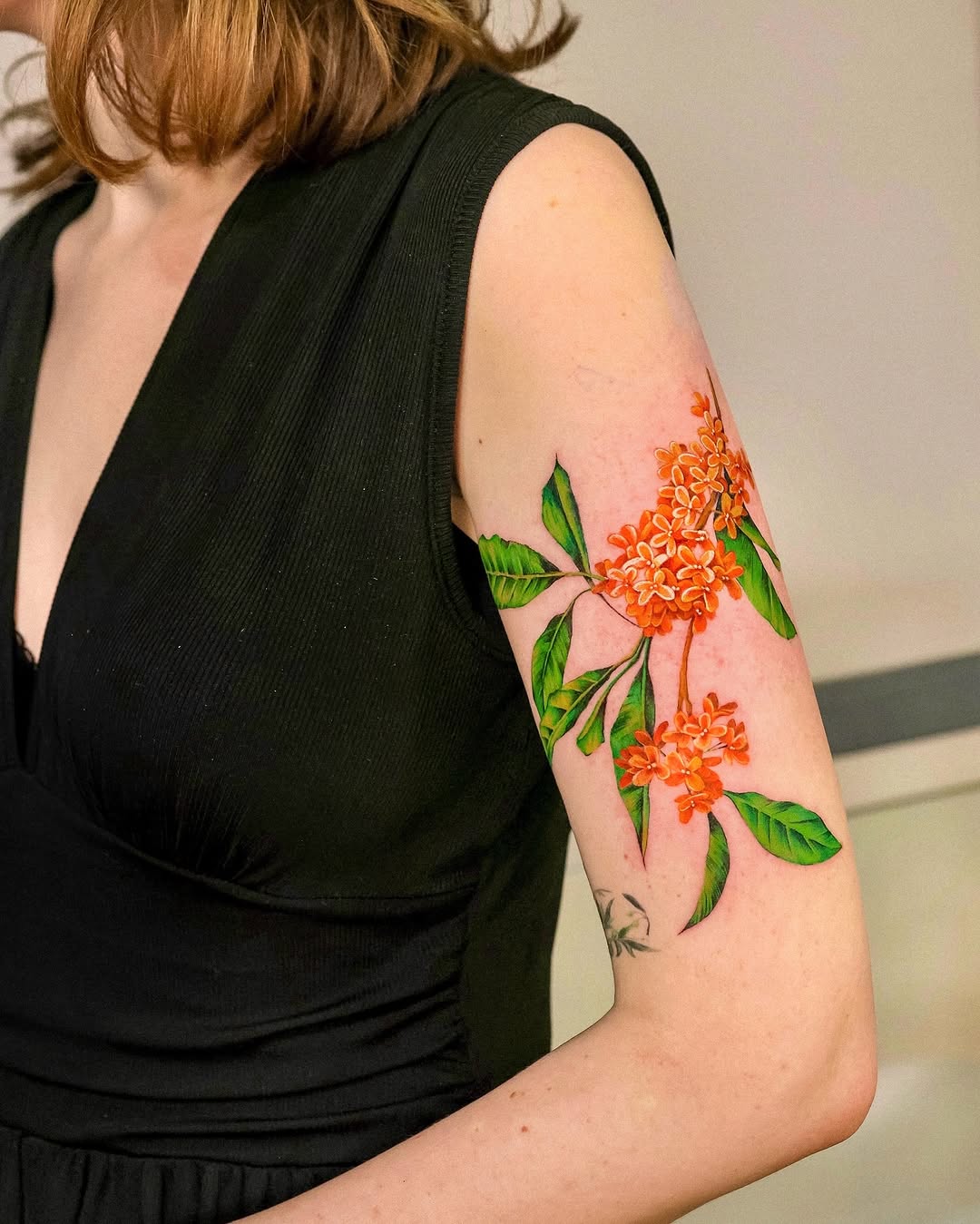 Vibrant floral sleeve tattoo exuding natural beauty