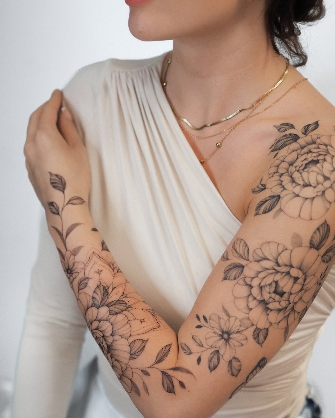 Stunning floral sleeve tattoo with intricate designs