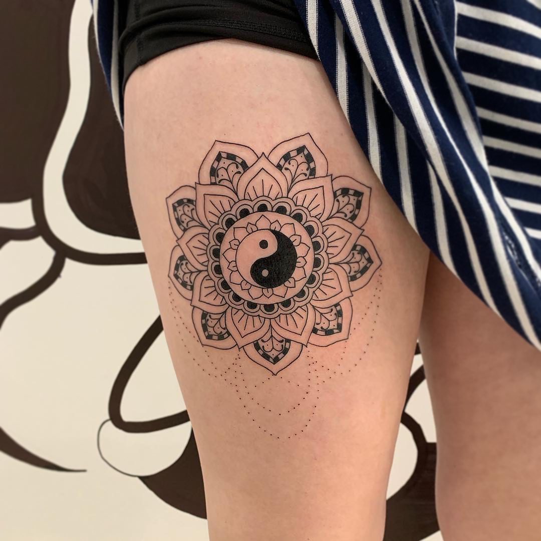 Intricate yin yang mandala thigh tattoo design