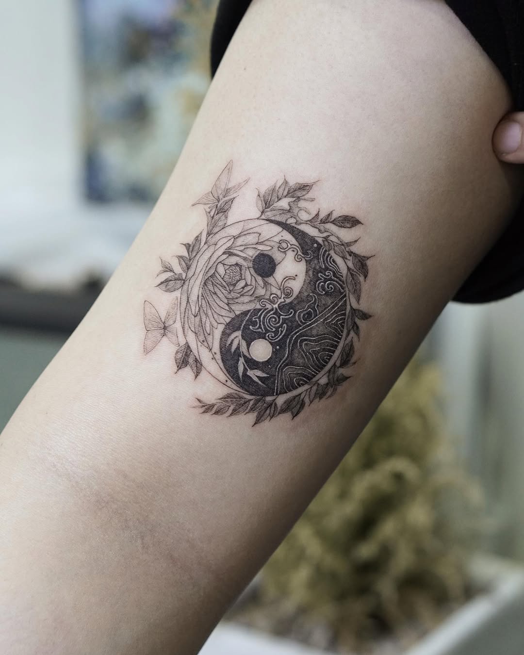 Nature-inspired yin yang tattoo with intricate details