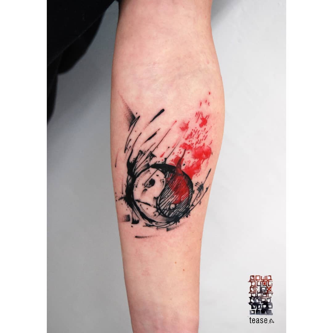 Dynamic yin yang tattoo with vibrant colors