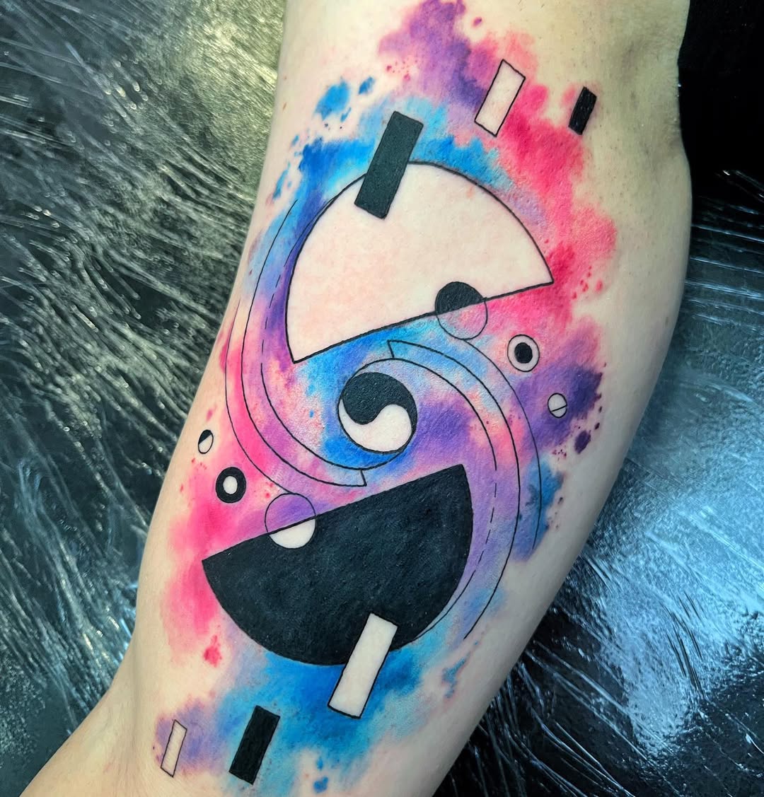 Dynamic yin yang tattoo with colorful splashes