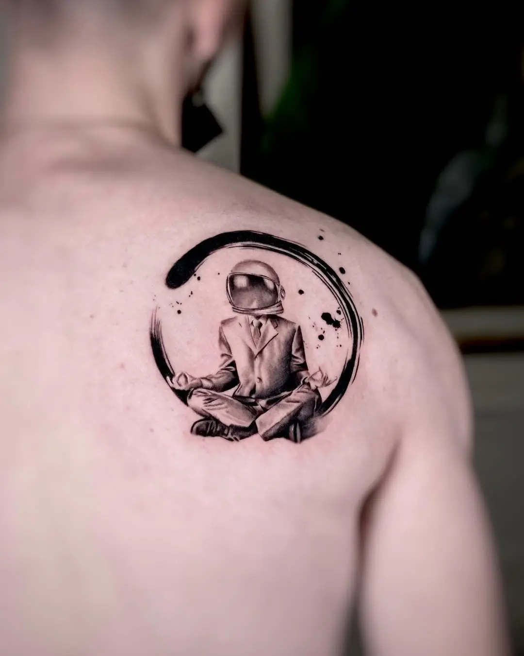 Creative astronaut tattoo blending yoga and art