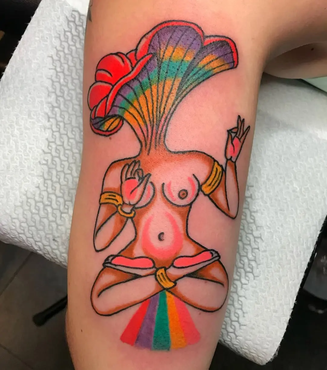 Vibrant goddess in meditative pose tattoo