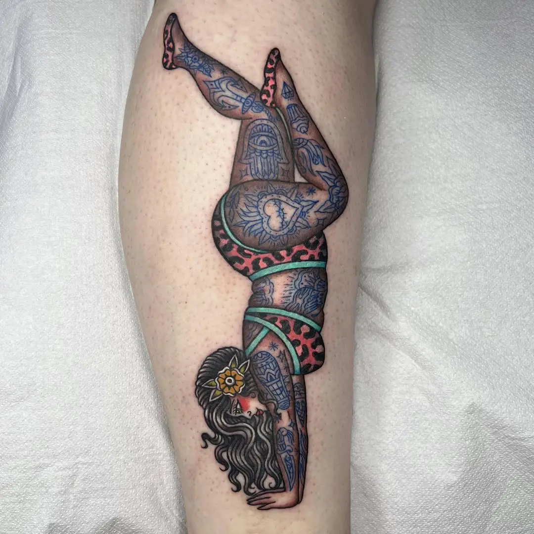 Elegant yoga pose tattoo with vibrant colors